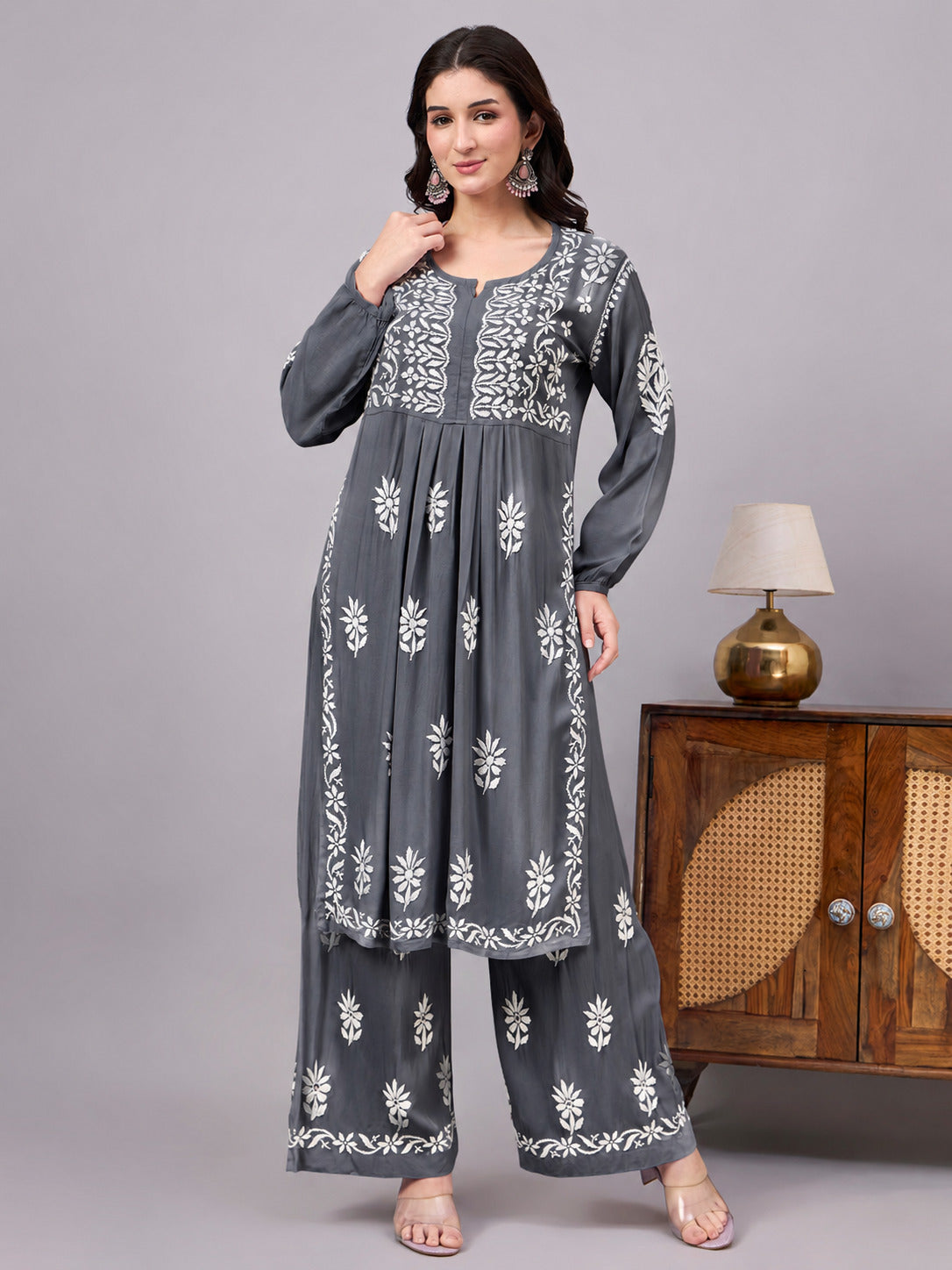 Traditional Rayon A-Line Kurta Set crafted by skilled artisans using authentic Chikankari embroidery techniques, paired with an embroidered palazzo for a complete ethnic ensemble.