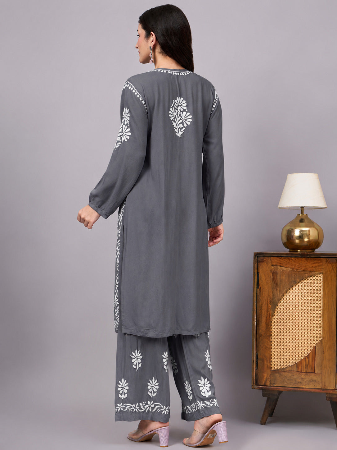 Women's comfortable regular wear kurta palazzo set with authentic handcrafted Chikankari embroidery, lightweight rayon fabric, and a flowing A-line silhouette.