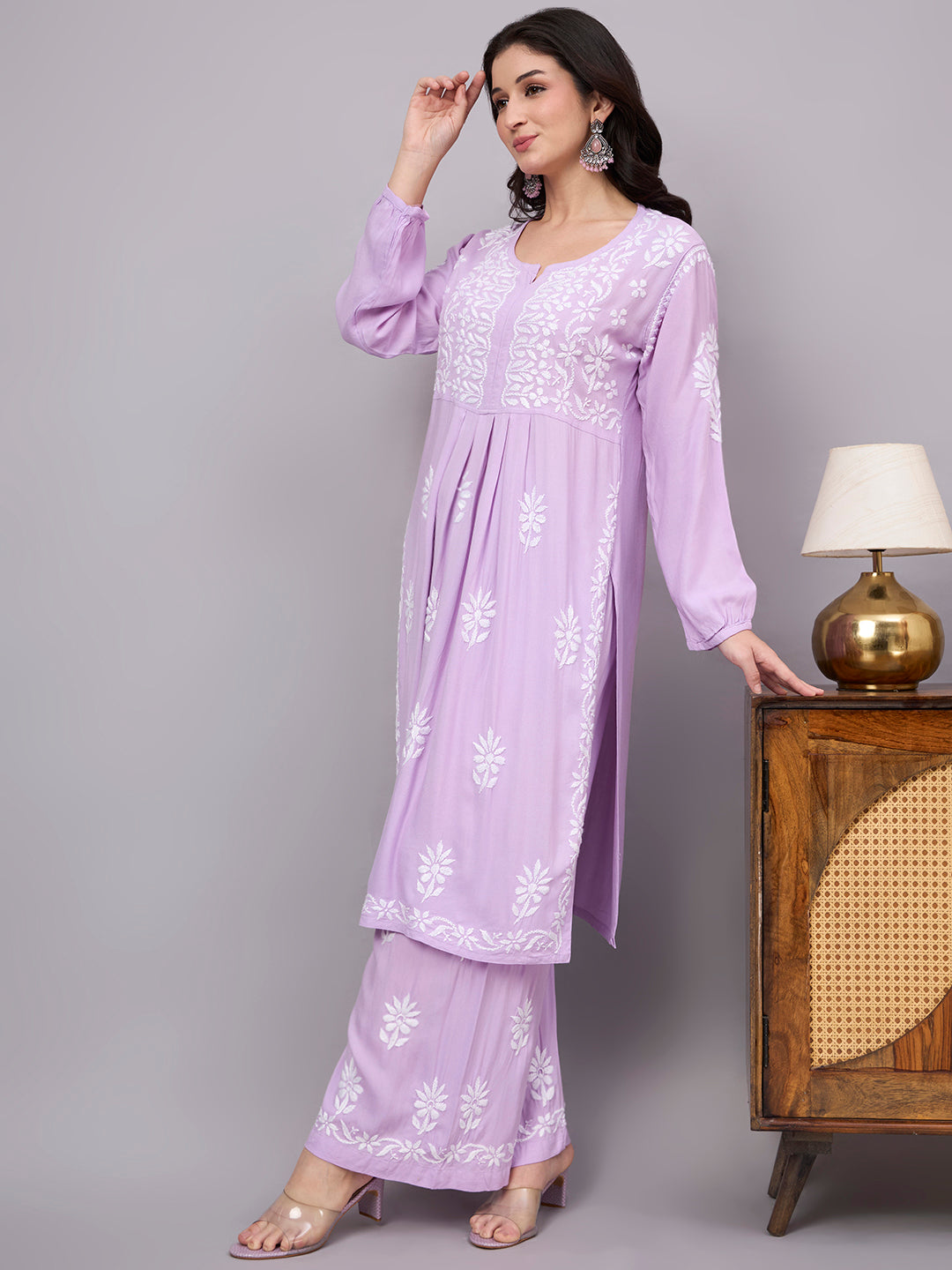 Handcrafted trending kurta set featuring authentic Chikankari embroidery, premium rayon construction, elegant A-line styling, and coordinated palazzo for contemporary ethnic wardrobes.