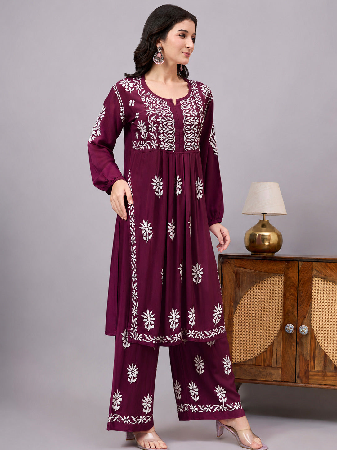 Women's handcrafted Chikankari Set designed with intricate floral embroidery, an A-line kurta, and matching palazzo for effortless ethnic fashion and everyday comfort.