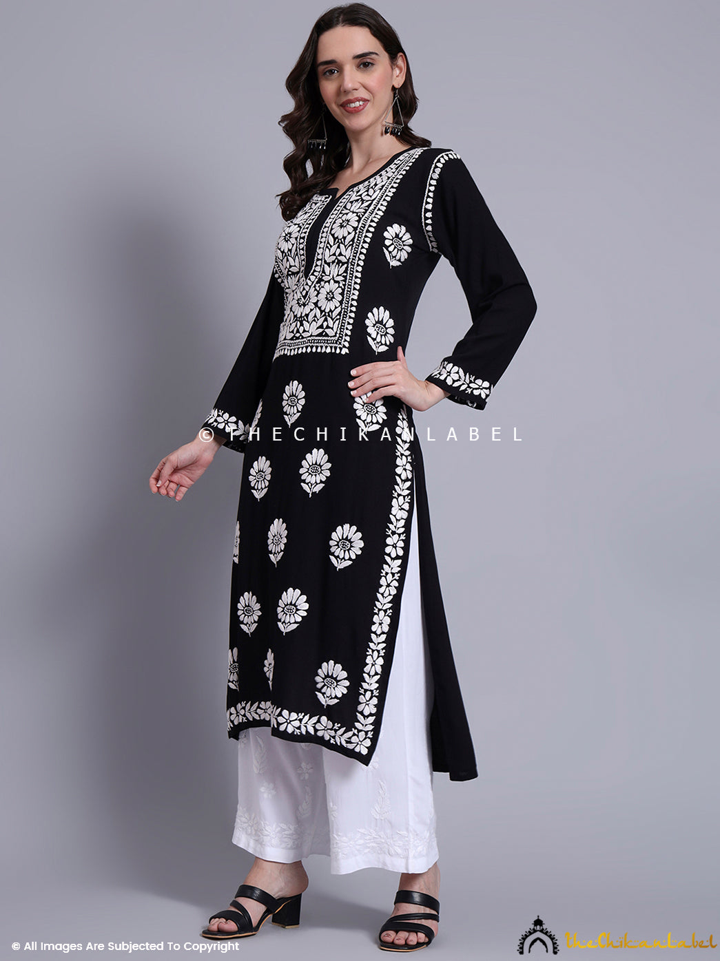 Full-length rayon kurti with authentic chikankari work displayed on front panel, sleeves, and hemline.

