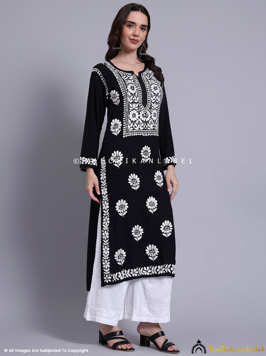 Traditional rayon chikankari straight kurti designed with delicate thread embroidery and classic neckline.

