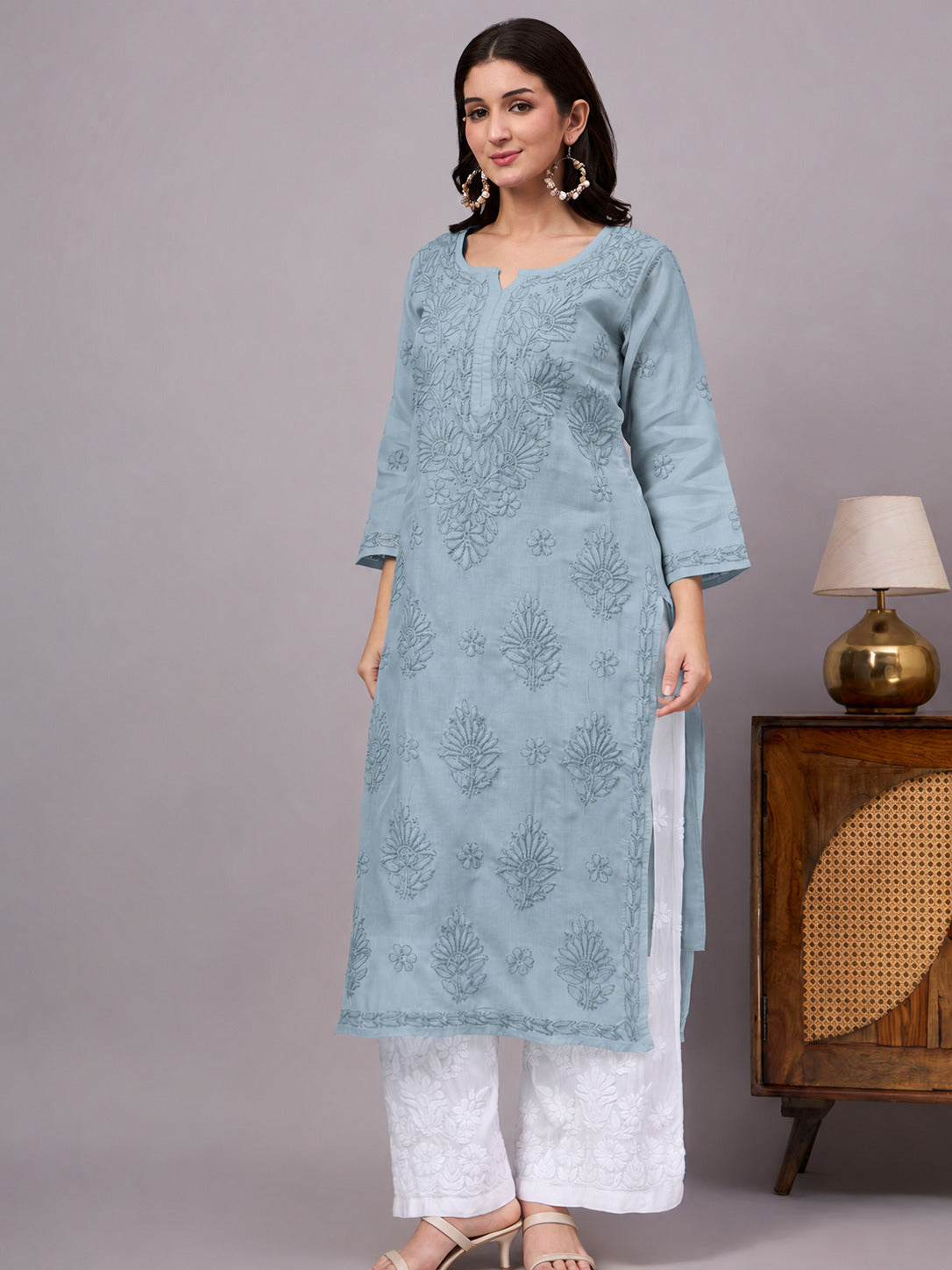 Authentic Cotton Straight Kurti designed with handcrafted floral Chikankari embroidery, breathable fabric, and an attached inner for all-day comfort.