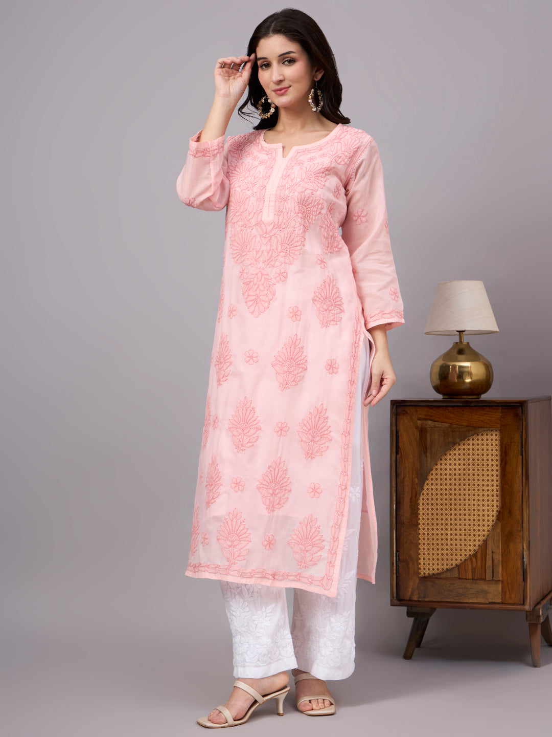Women's handcrafted Cotton Straight Kurti with authentic floral Chikankari embroidery, comfortable regular fit, and breathable fabric for daily wear and festive occasions.