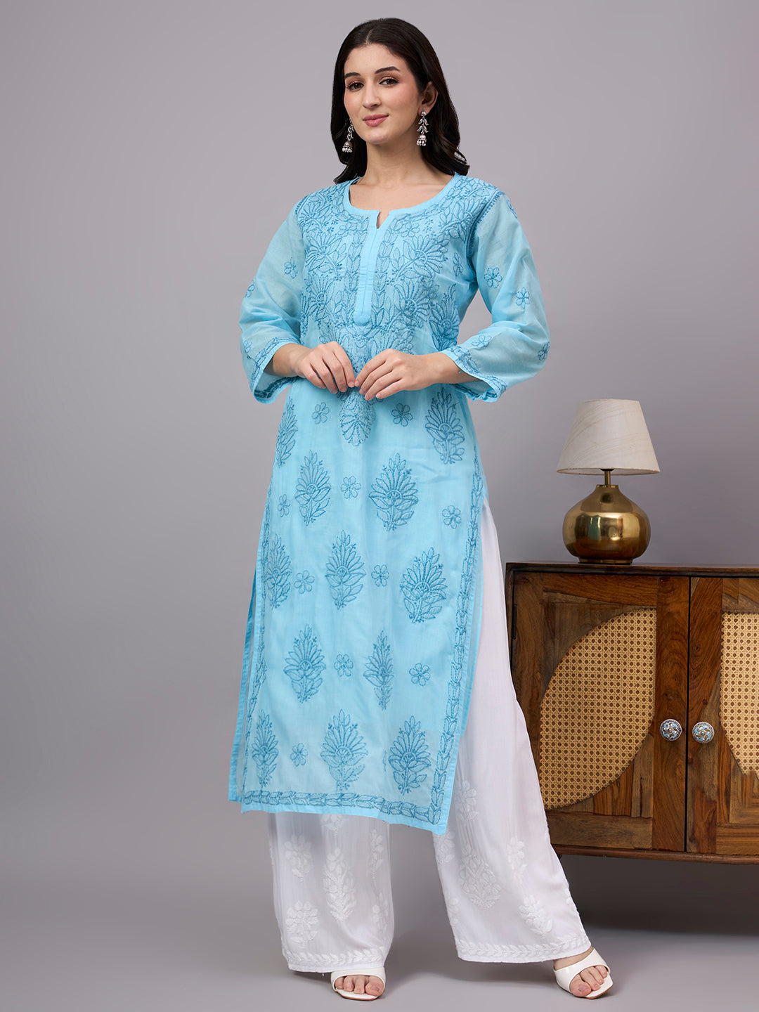 Authentic Cotton Straight Kurti designed with handcrafted floral Chikankari embroidery, breathable fabric, and an attached inner for all-day comfort.