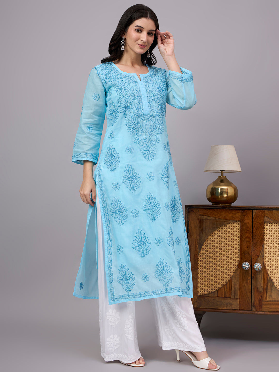 Women's handcrafted Chikankari Kurta made from breathable cotton fabric with detailed artisan embroidery and a comfortable regular fit for every occasion.