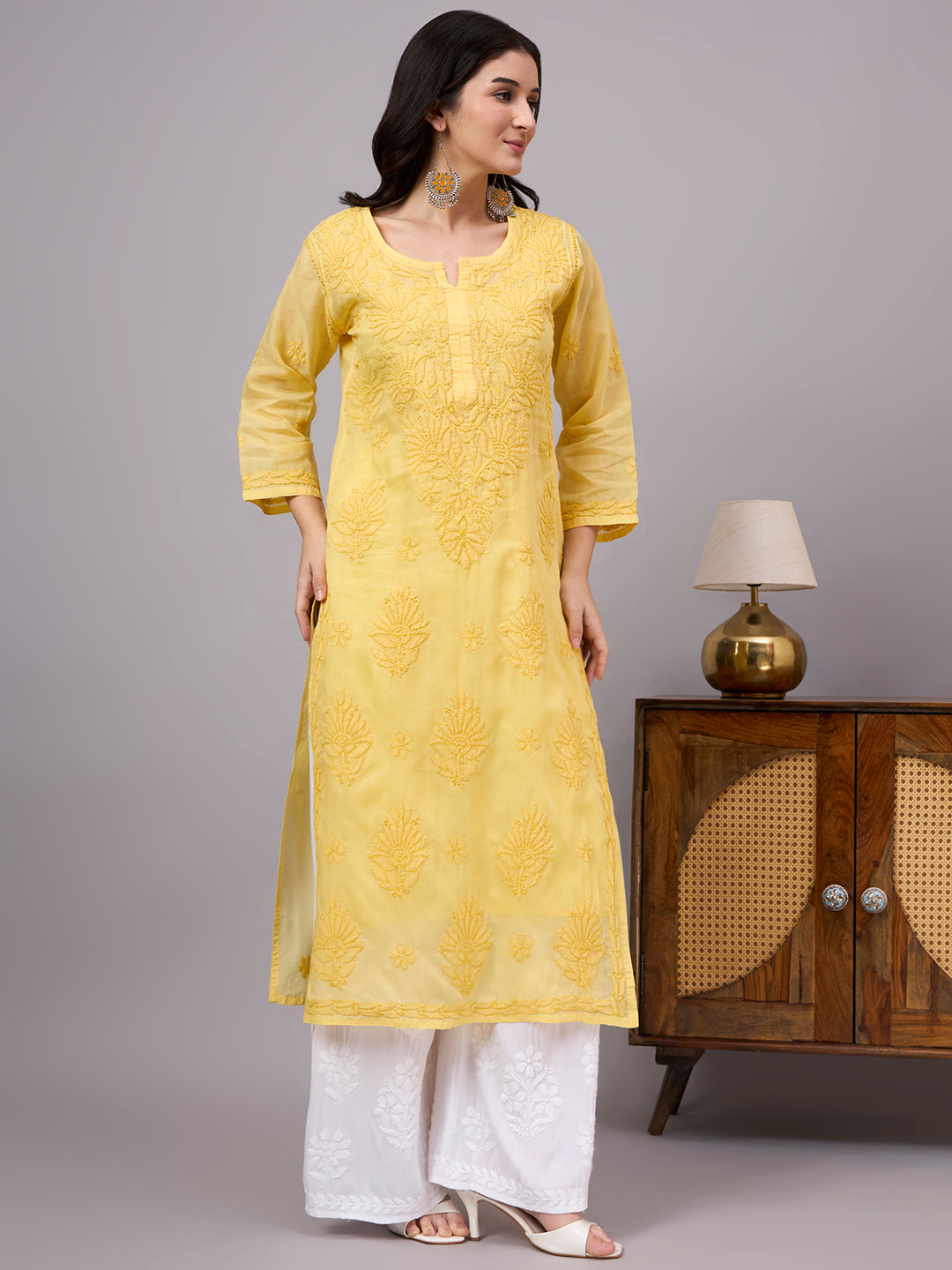 Authentic Cotton Straight Kurti designed with handcrafted floral Chikankari embroidery, breathable fabric, and an attached inner for all-day comfort.