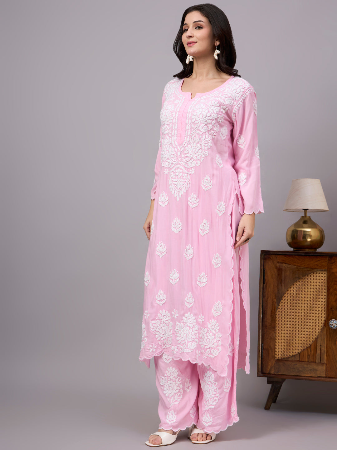 Women's trending Chikankari set showcasing artisan-made embroidery, soft modal construction, and a classic ethnic design suitable for modern wardrobes.