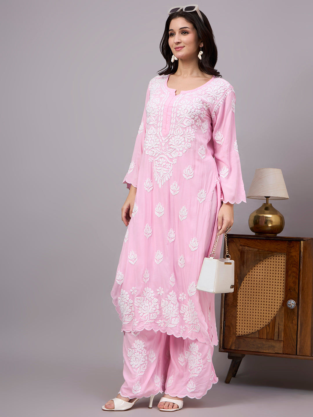 Elegant comfortable regular wear set designed with premium modal fabric, handcrafted Chikankari work, straight kurti style, and matching embroidered palazzo.