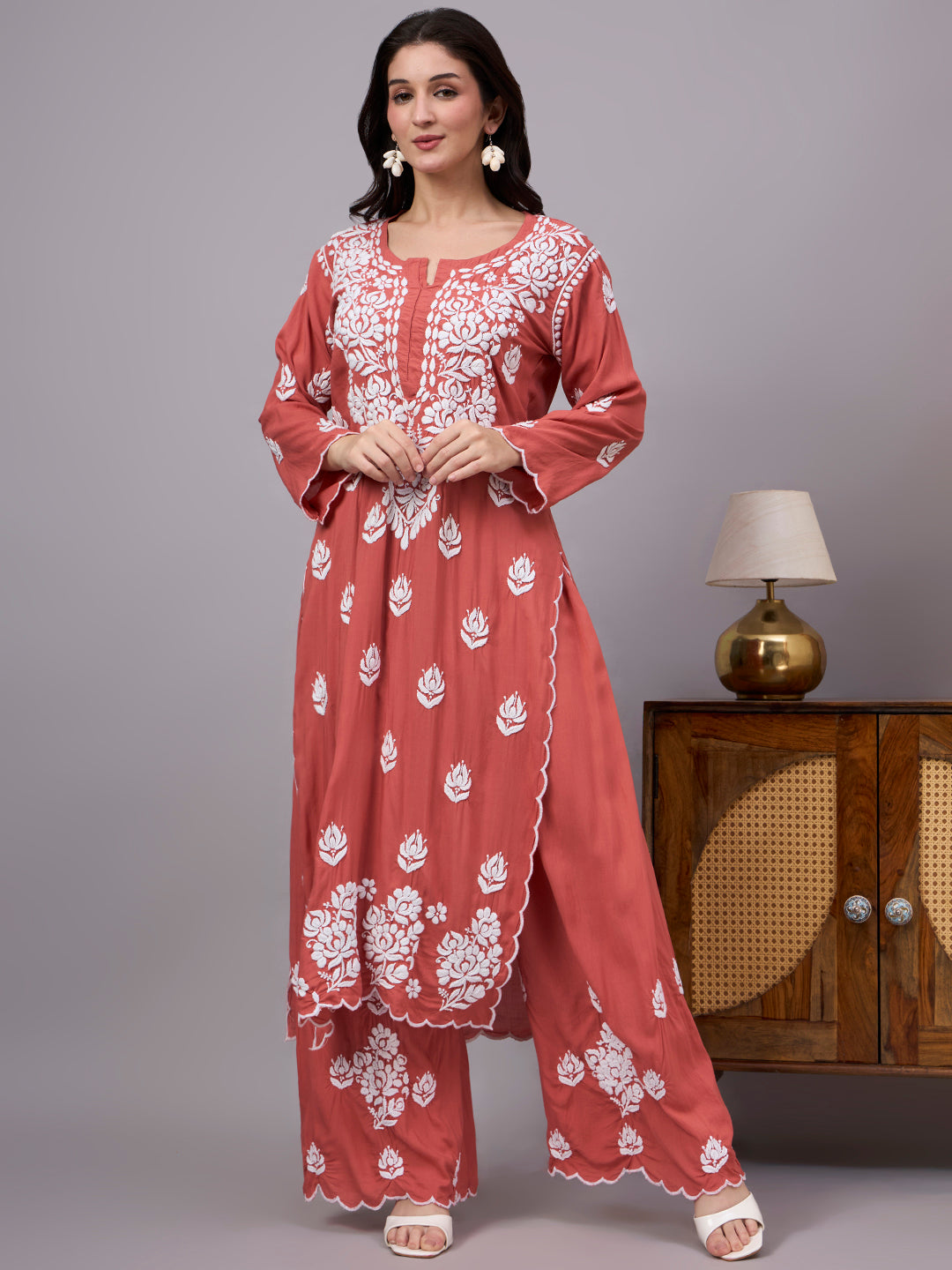 Elegant comfortable regular wear set designed with premium modal fabric, handcrafted Chikankari work, straight kurti style, and matching embroidered palazzo.
