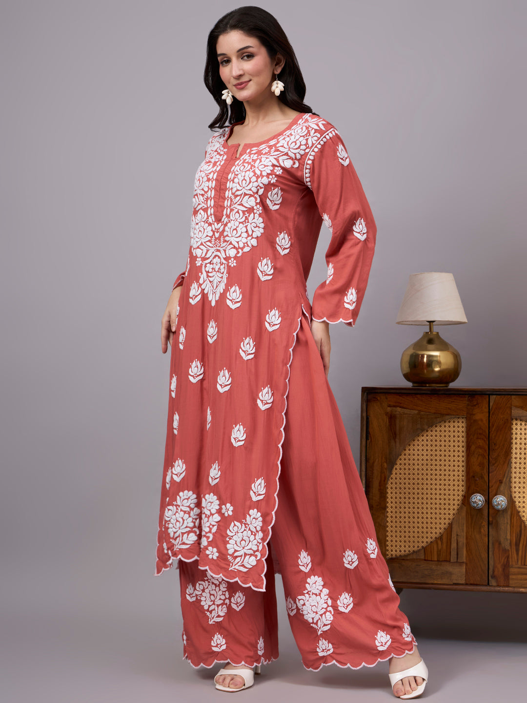Women's trending Chikankari set showcasing artisan-made embroidery, soft modal construction, and a classic ethnic design suitable for modern wardrobes.