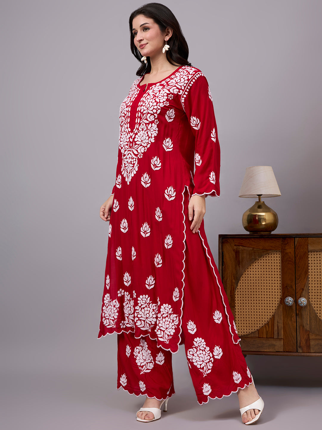 Elegant comfortable regular wear set designed with premium modal fabric, handcrafted Chikankari work, straight kurti style, and matching embroidered palazzo.