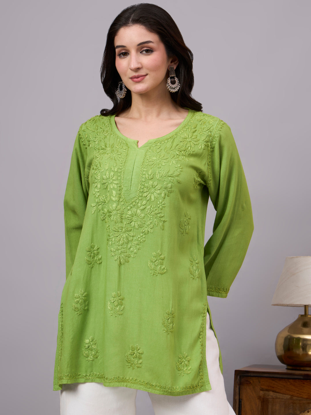 Trending Chikankari top for women with handcrafted embroidery details, soft rayon texture, and elegant short kurta design for casual occasions