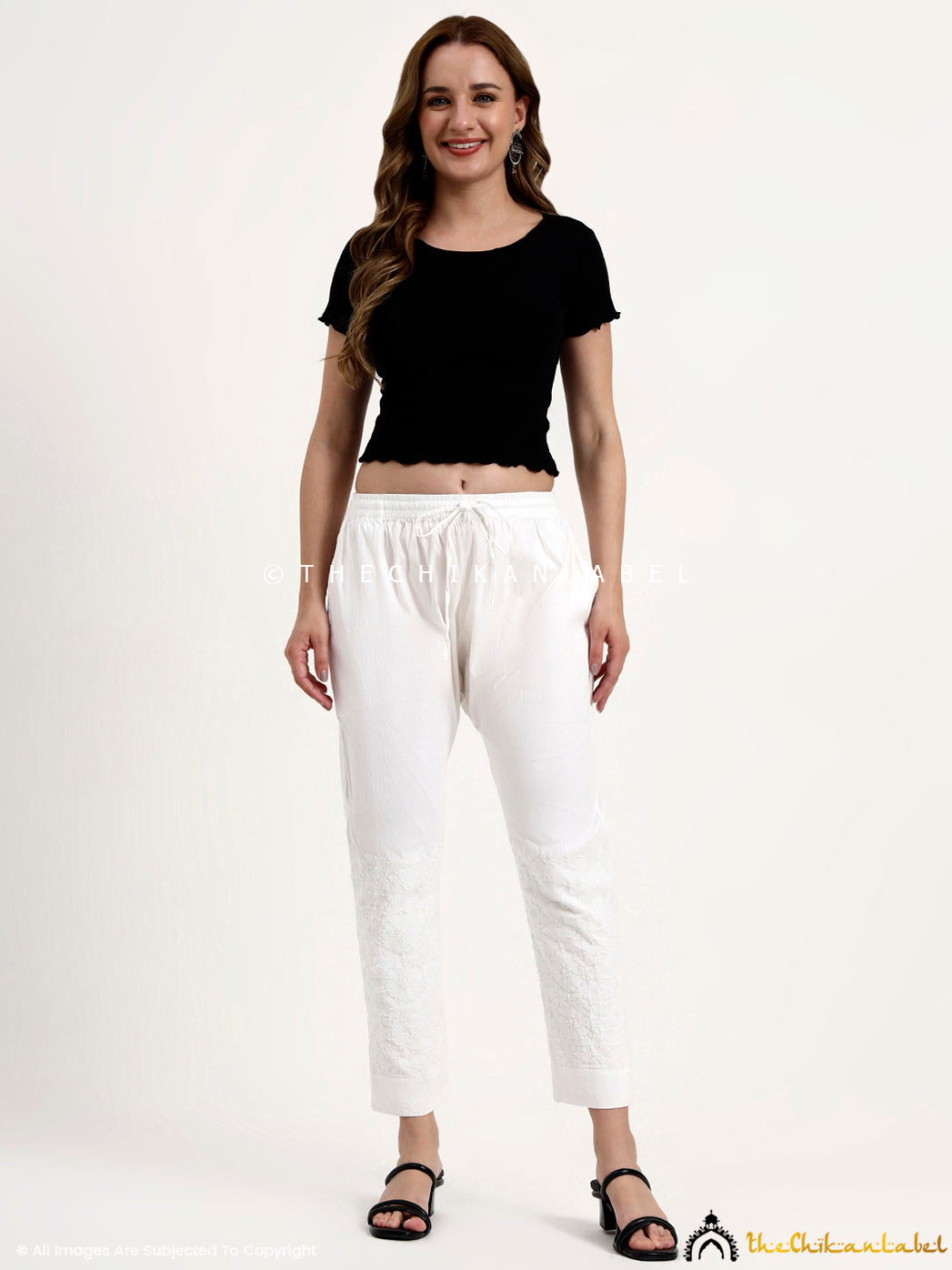 Ethnic wear cotton pant with straight silhouette and intricate hand-embroidered chikankari work.