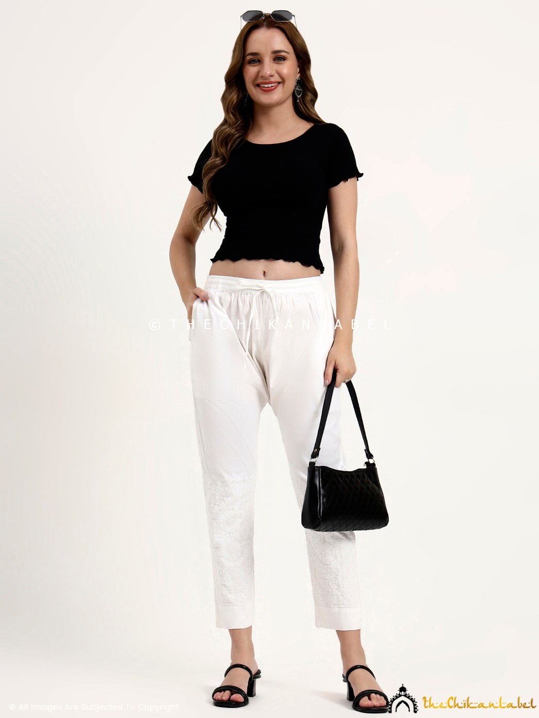 Elegant cotton chikankari pant with embroidered detailing on the lower panel.