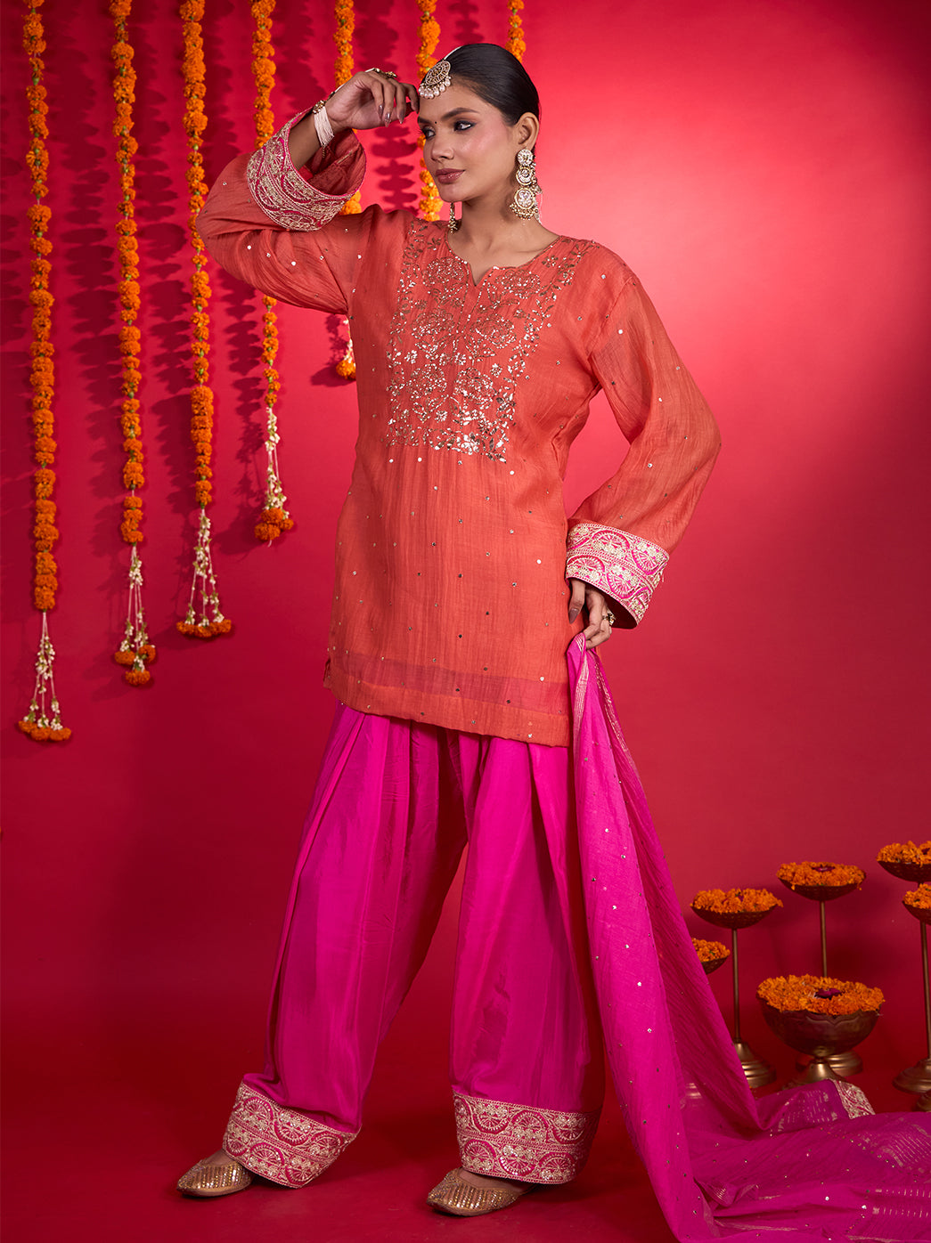 Noorani Mul Chanderi festive outfit featuring a rounded slit neckline, botanical embroidery, scattered embellishments and an ornate dupatta border.