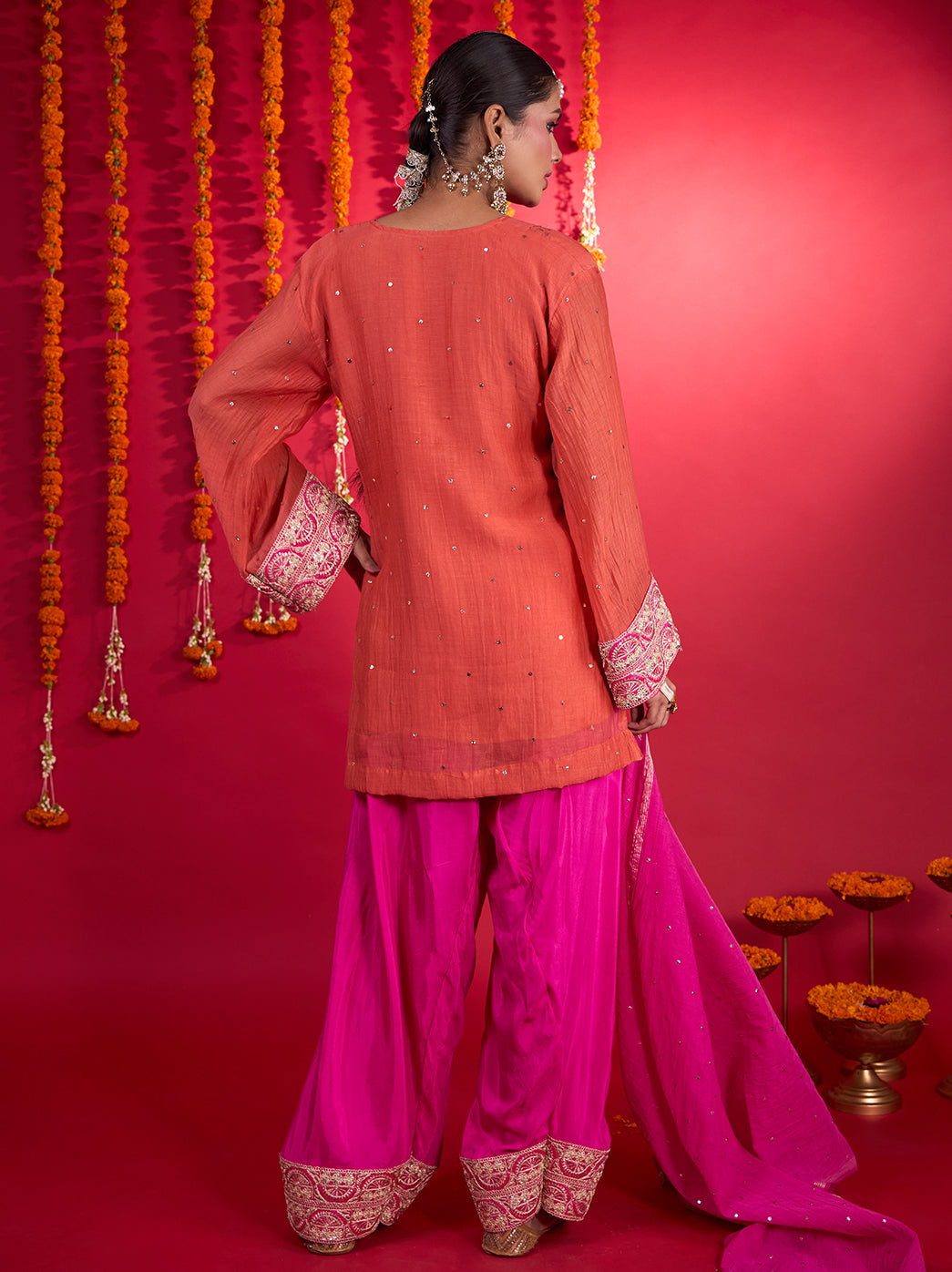 Noorani three-piece Mul Chanderi kurta set with a relaxed embroidered top, voluminous Farshi bottoms and a coordinating embellished dupatta.
