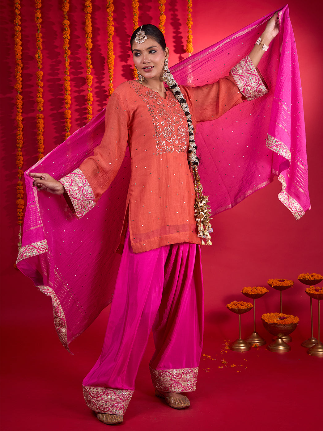 Model wearing the Noorani Chikankari kurta set with a sheer dupatta draped from the shoulder and wide-leg pants falling to the ankles.