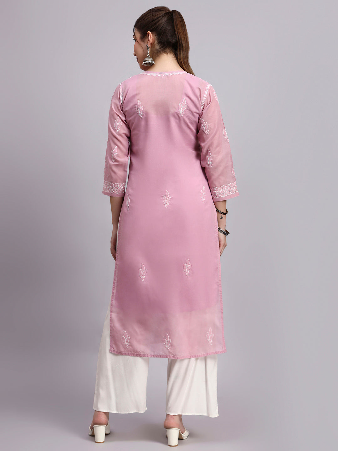 Trending women kurta with classic embroidery and straight fit design suitable for office and daily wear