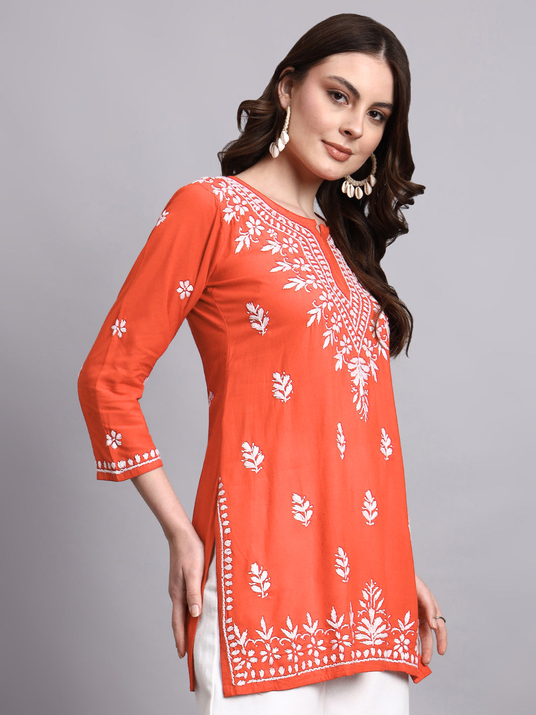 Trending ethnic short kurta crafted with hand-embroidered chikankari and breathable rayon material