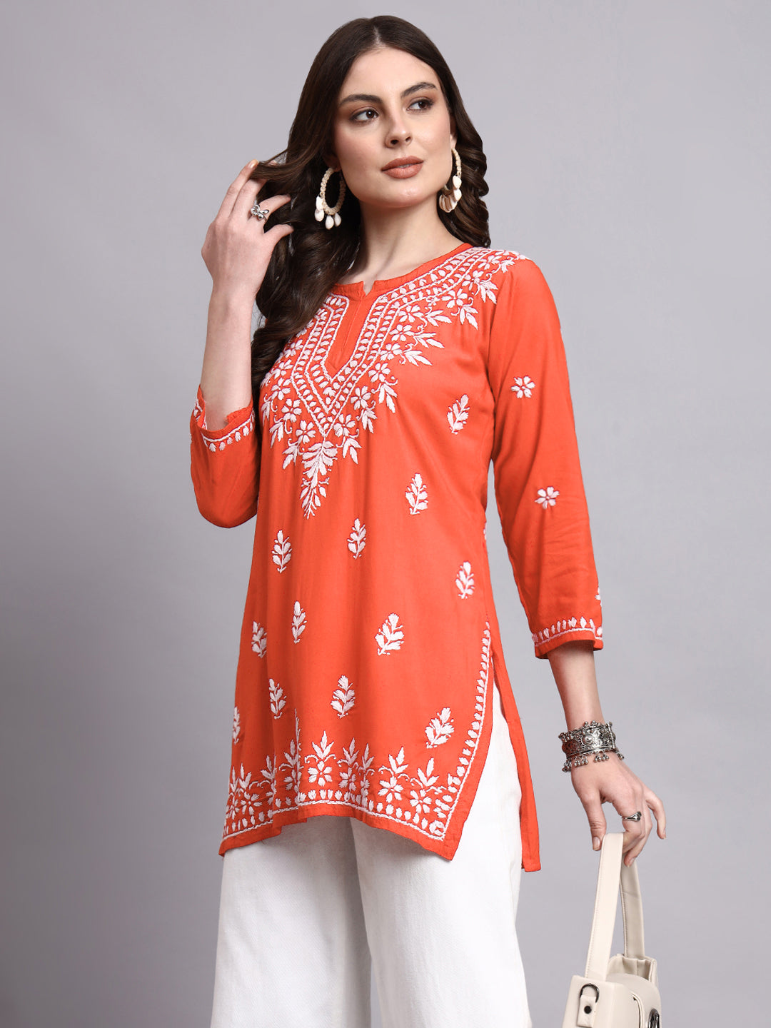 Women’s rayon short kurta with subtle chikankari embroidery for refined ethnic wear