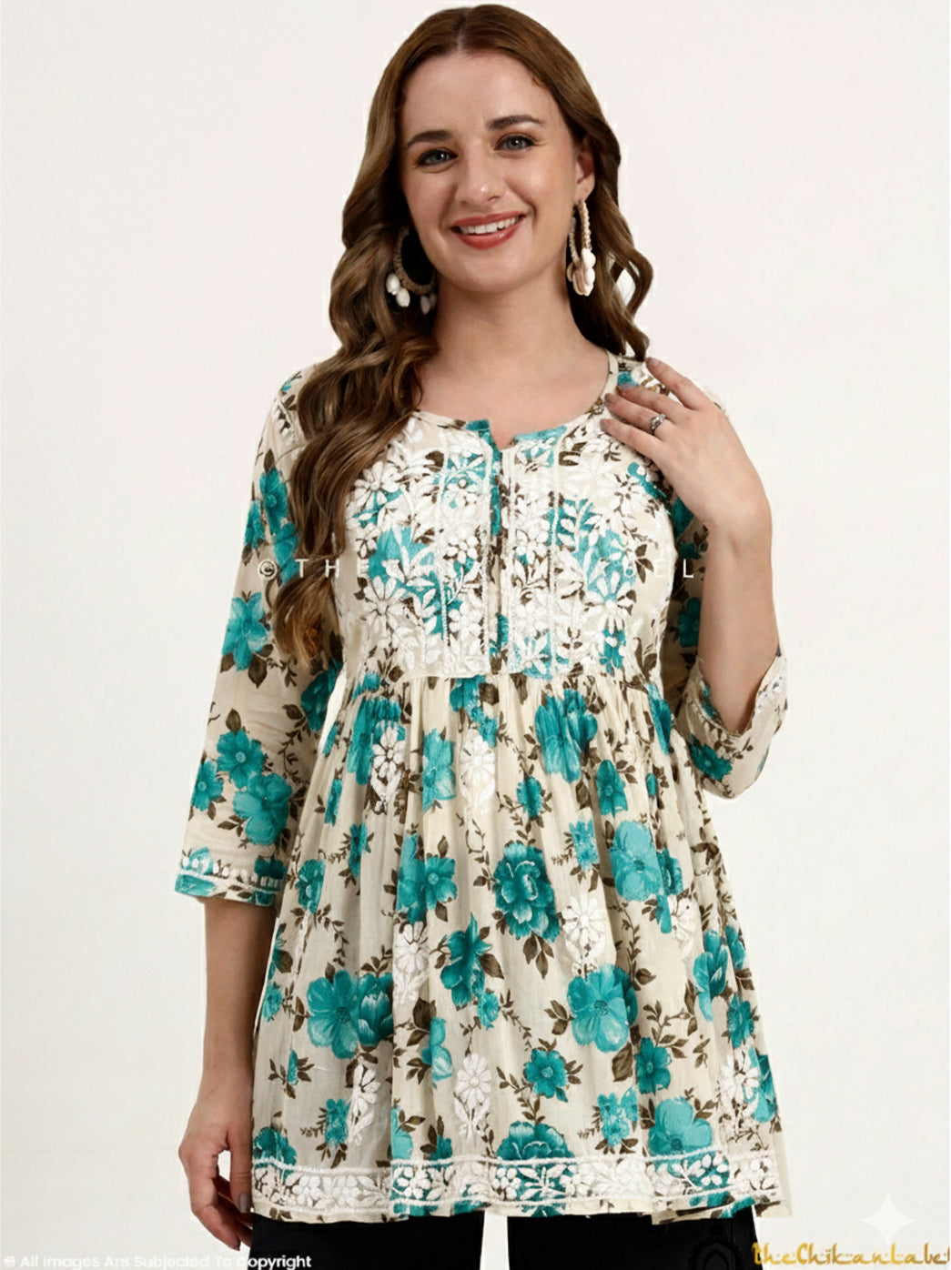 Mulmul Cotton Chikankari Short Top featuring handcrafted embroidery on a soft printed fabric, showcased on a model for online fashion listing.