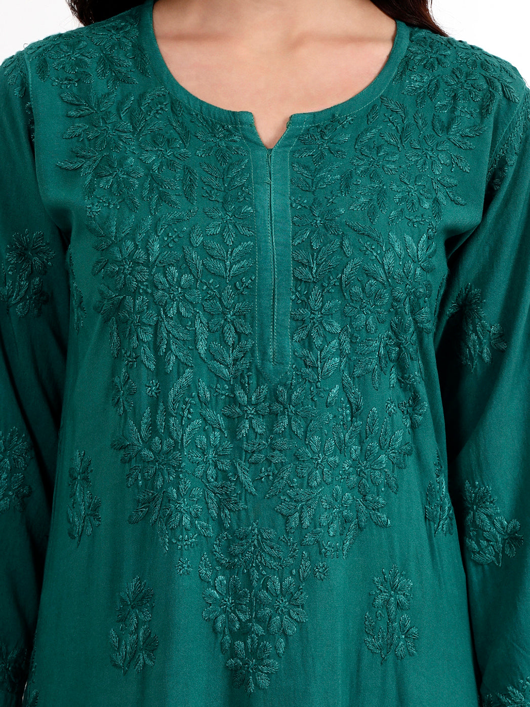 Women ethnic wear chikankari kurta set featuring detailed neckline and sleeve embroidery