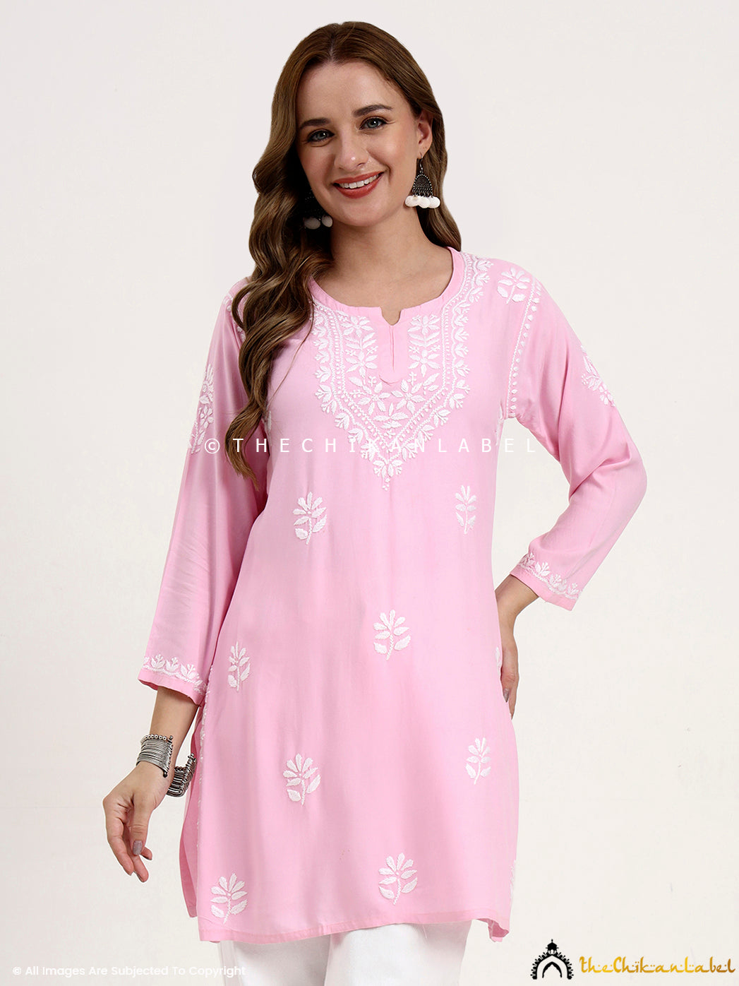 Premium rayon chikankari short top for women with hand embroidery on neckline and sleeves.