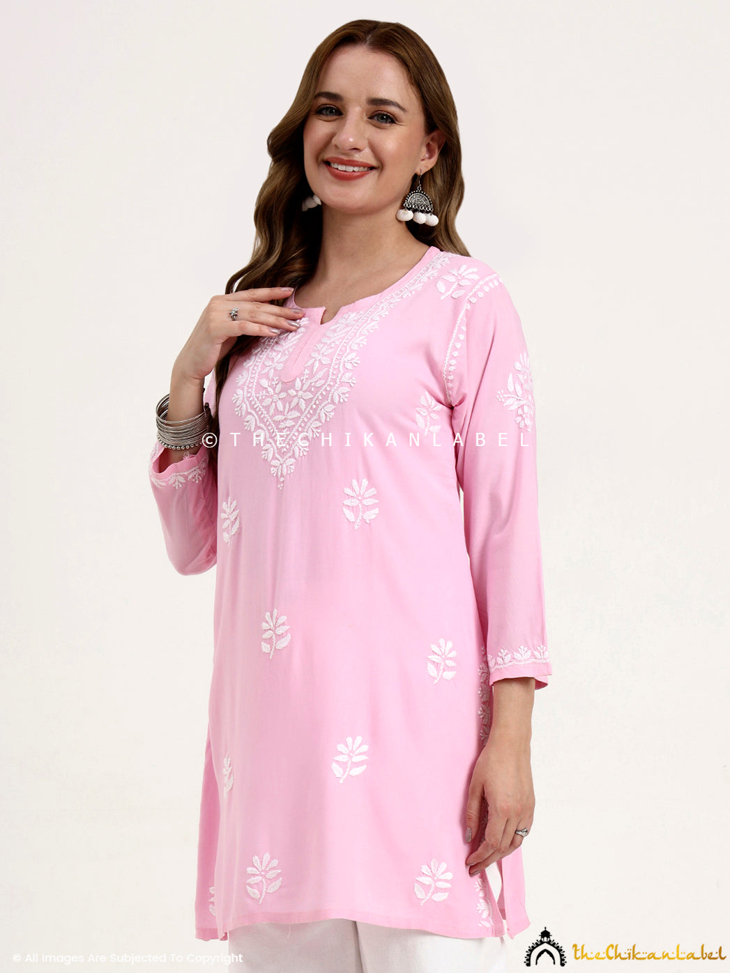 Lightweight rayon chikankari short kurti top for women’s casual and office outfits.