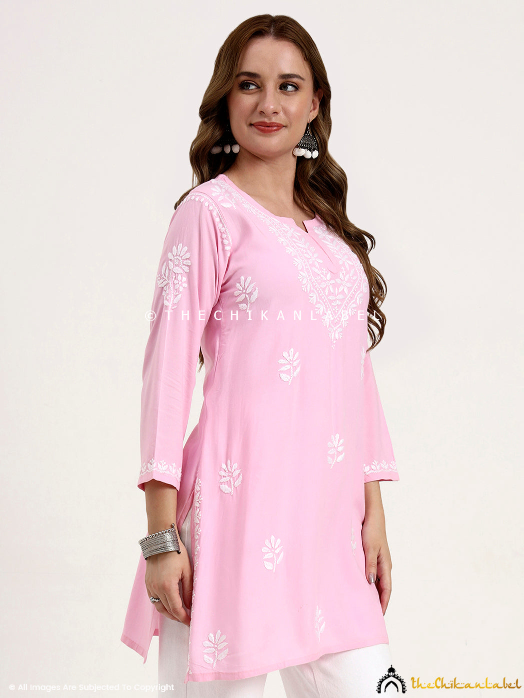 Rayon chikankari short top with intricate thread embroidery and stylish cut.