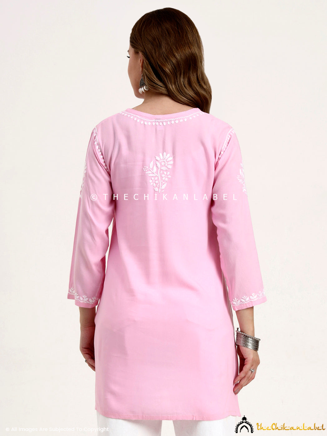 Elegant rayon short top with handcrafted chikankari work ideal for daily wear.
