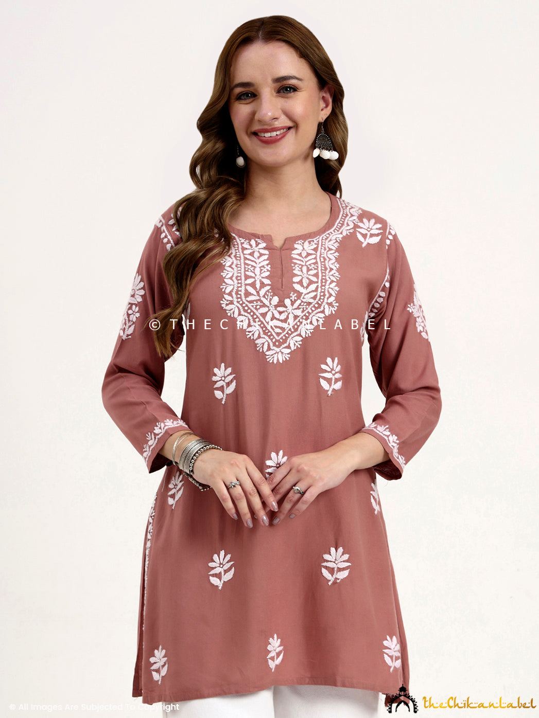 Trending chikankari short top made from rayon fabric ideal for fusion styling.