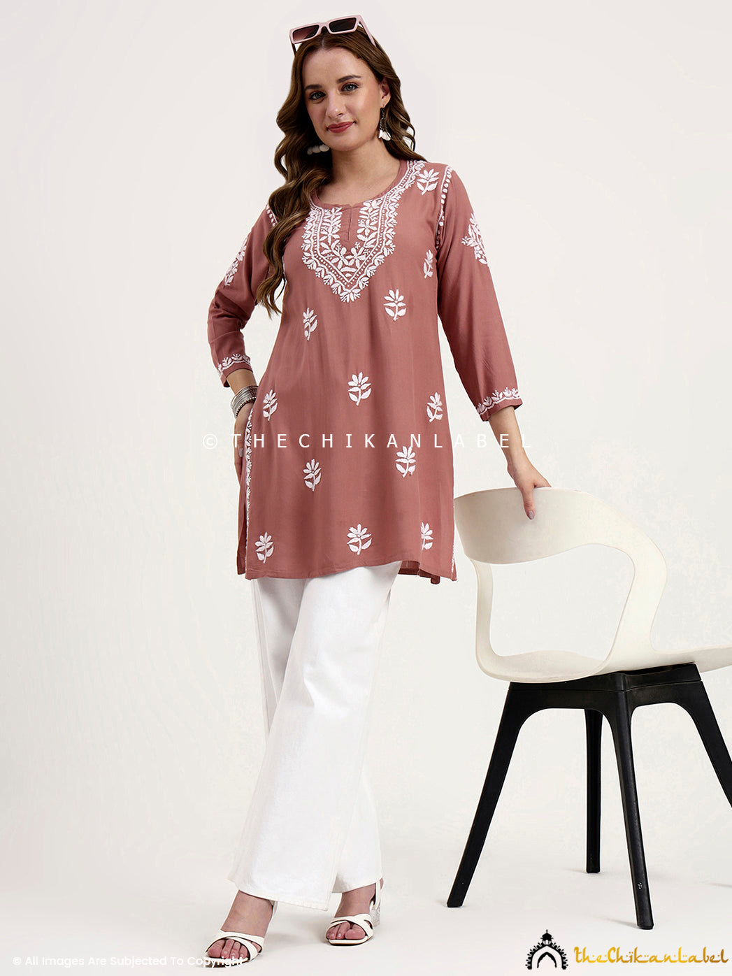 Women’s chikankari short top crafted in rayon fabric for elegant ethnic wear.
