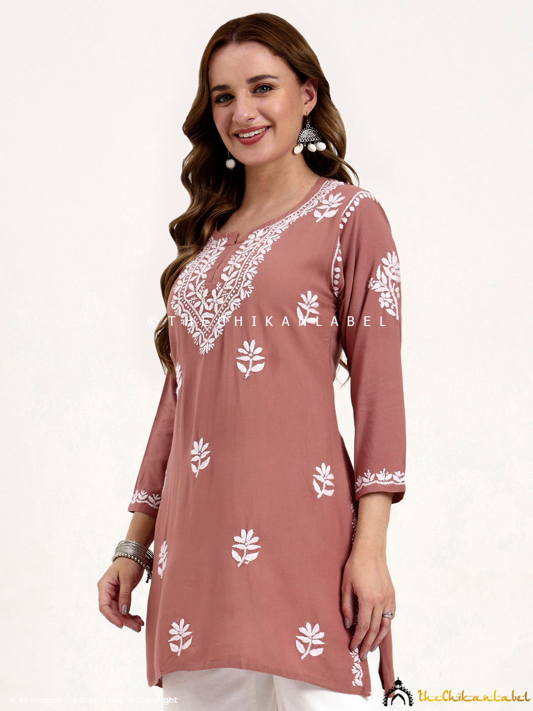 Embroidered rayon chikankari short kurti perfect for pairing with jeans or palazzos.