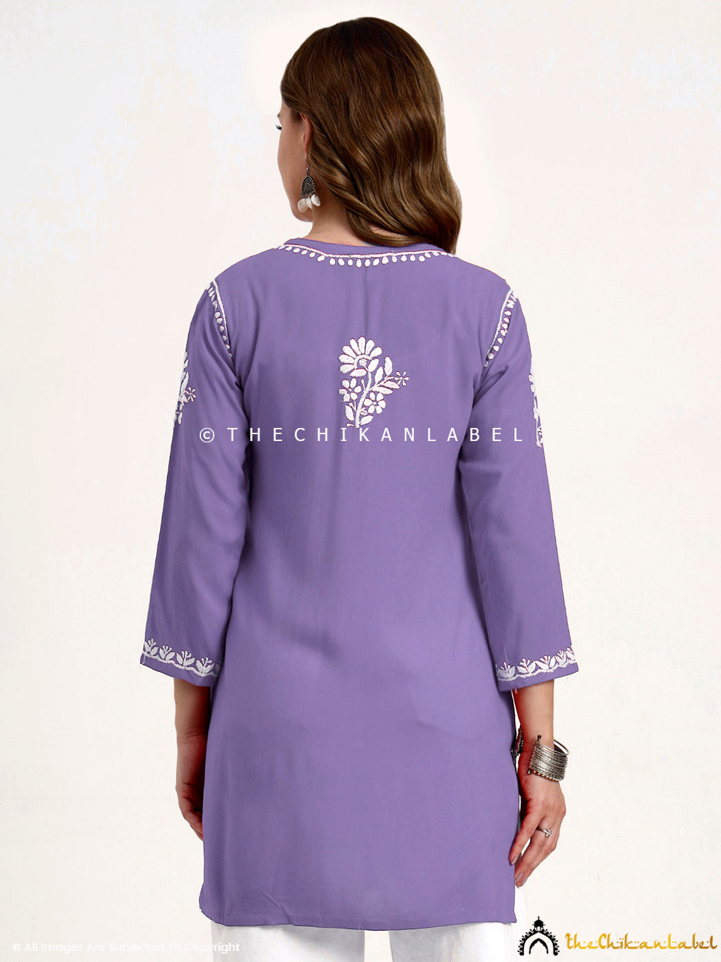 Chikankari short top for women in breathable rayon fabric with traditional handwork.