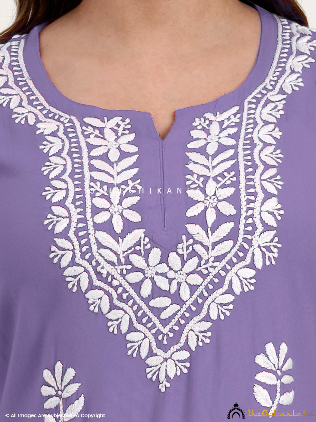 Elegant short kurti top in rayon with chikankari detailing for casual and office wear.