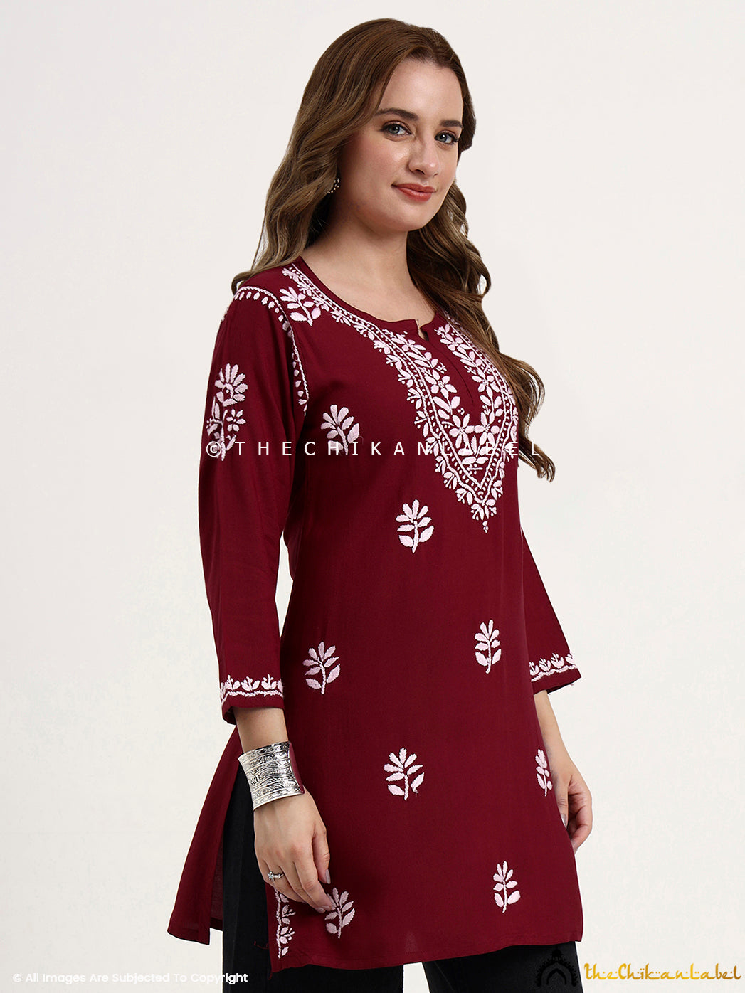 Traditional chikankari embroidery on rayon short kurti top designed for modern women.
