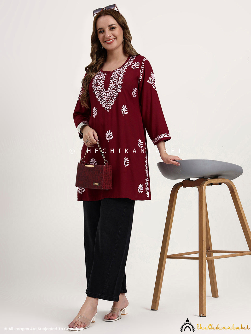 Artisan-made rayon chikankari short top featuring floral hand embroidery on fabric.