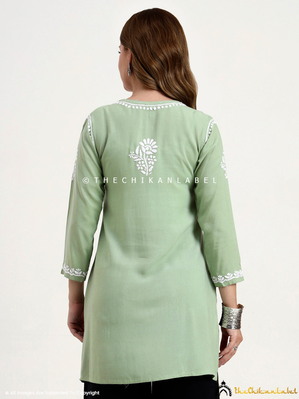 Rayon chikankari short kurti featuring ethnic motifs and comfortable silhouette.
