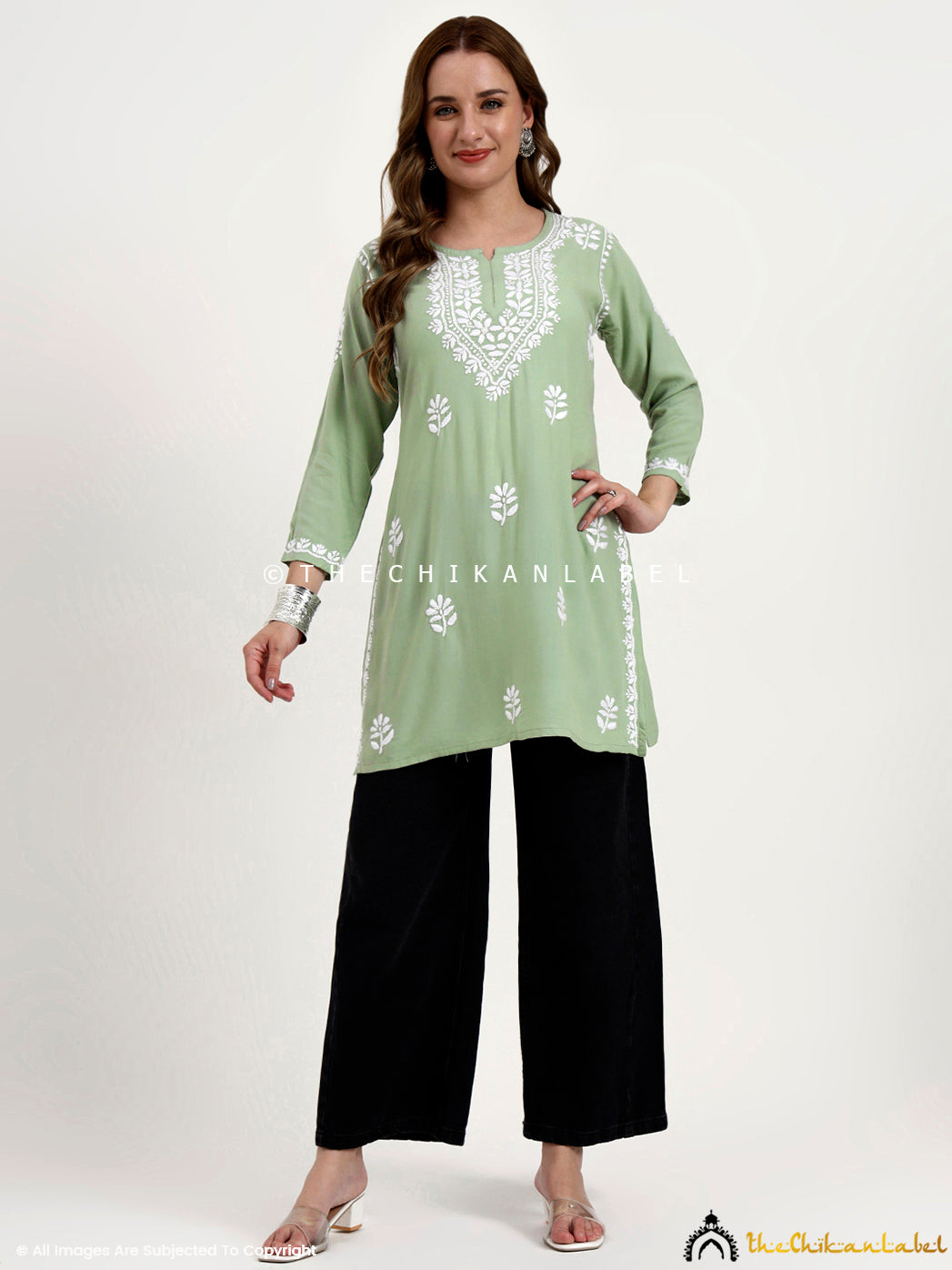 Trending chikankari short top in rayon fabric featuring traditional floral embroidery.
