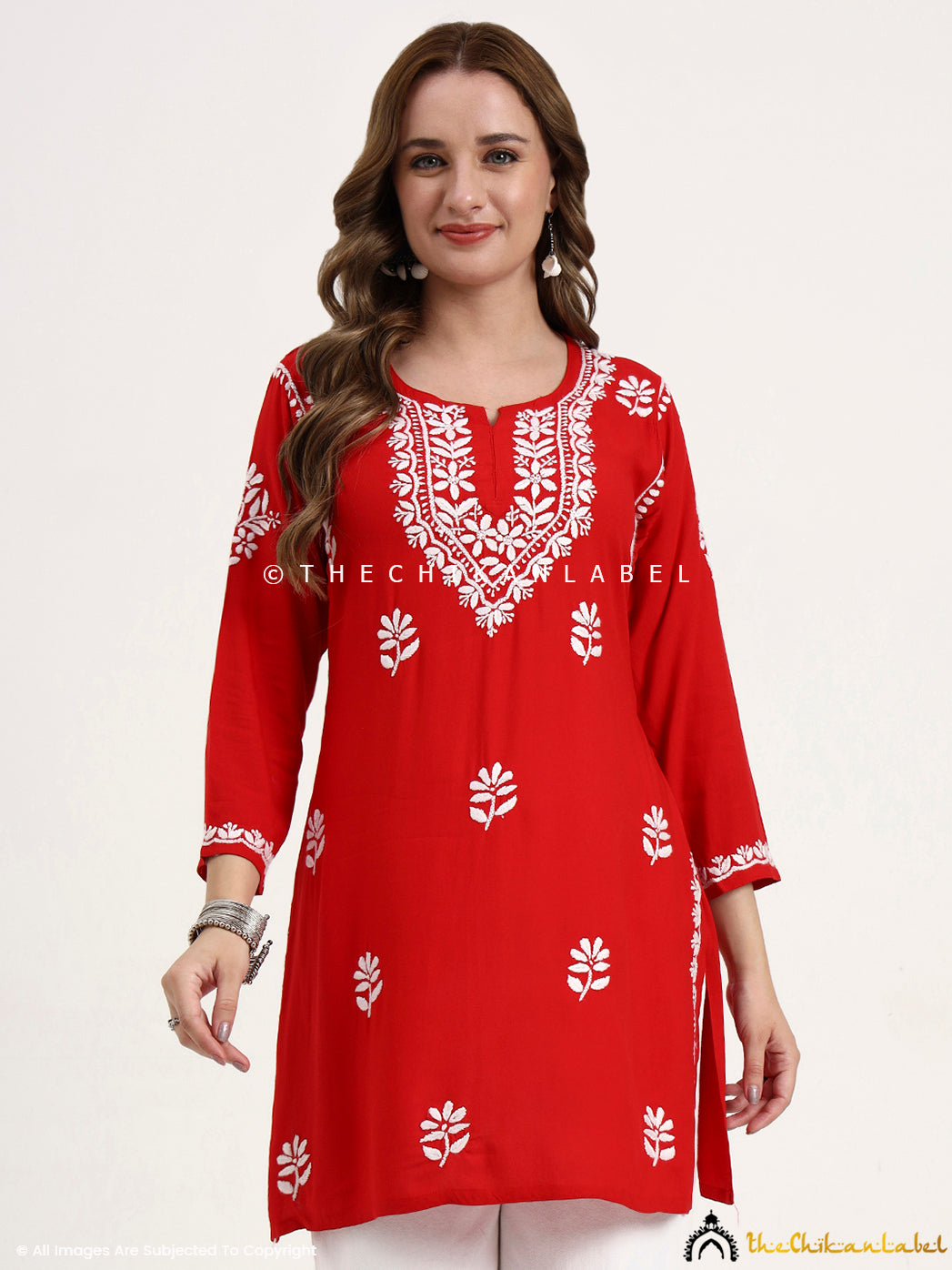 Women’s rayon chikankari embroidered short kurti top for casual and festive wear.