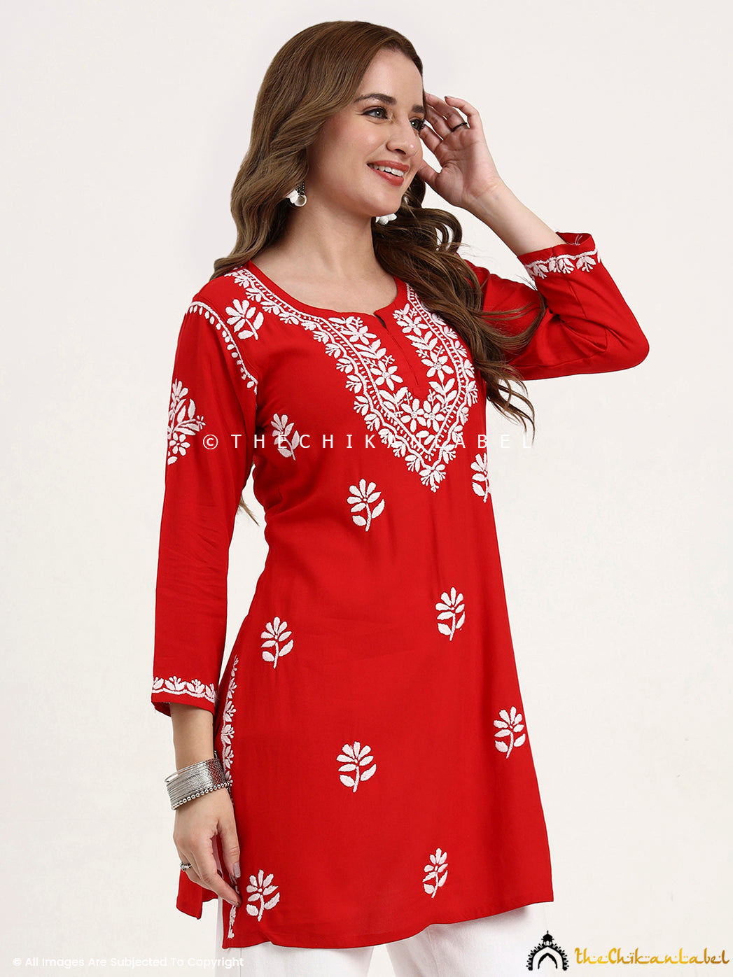 Rayon chikankari short top with embroidered motifs, great for office and travel wear.