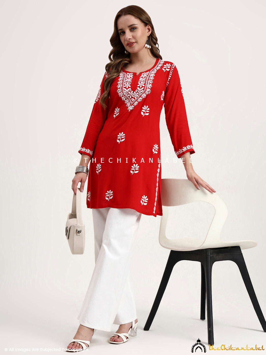 Hand embroidered rayon short chikankari top designed for comfort and elegance.