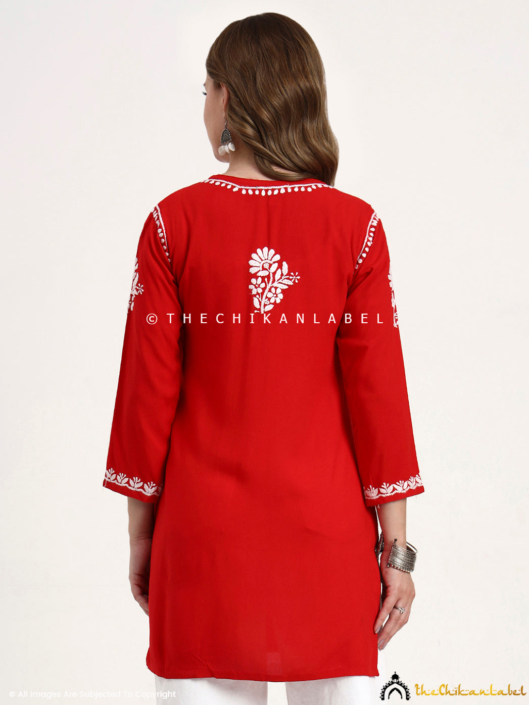 Everyday wear rayon short kurti top with chikankari hand embroidery on fabric.