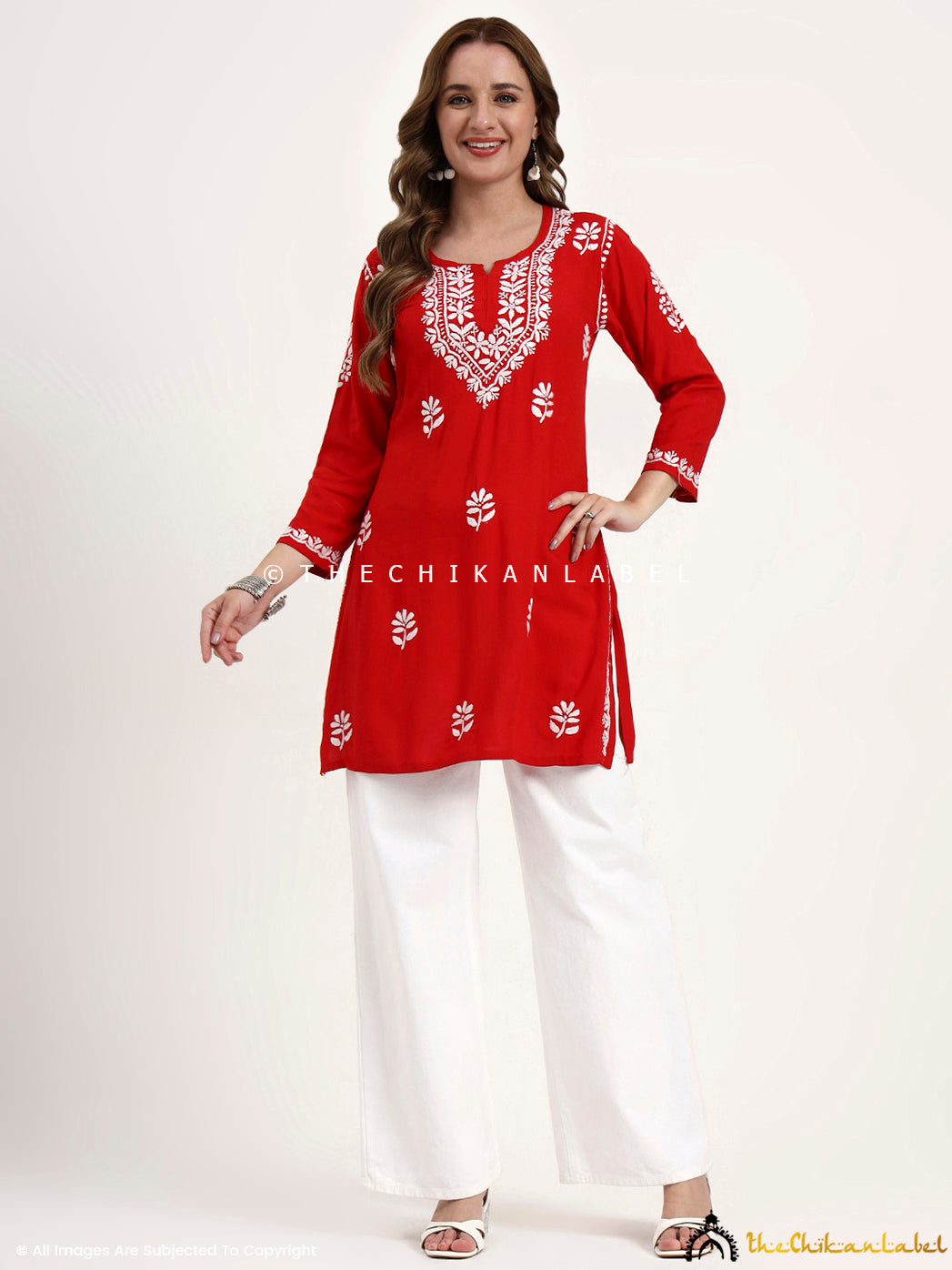 Women’s trending chikankari short top in breathable rayon fabric with artisan stitch.