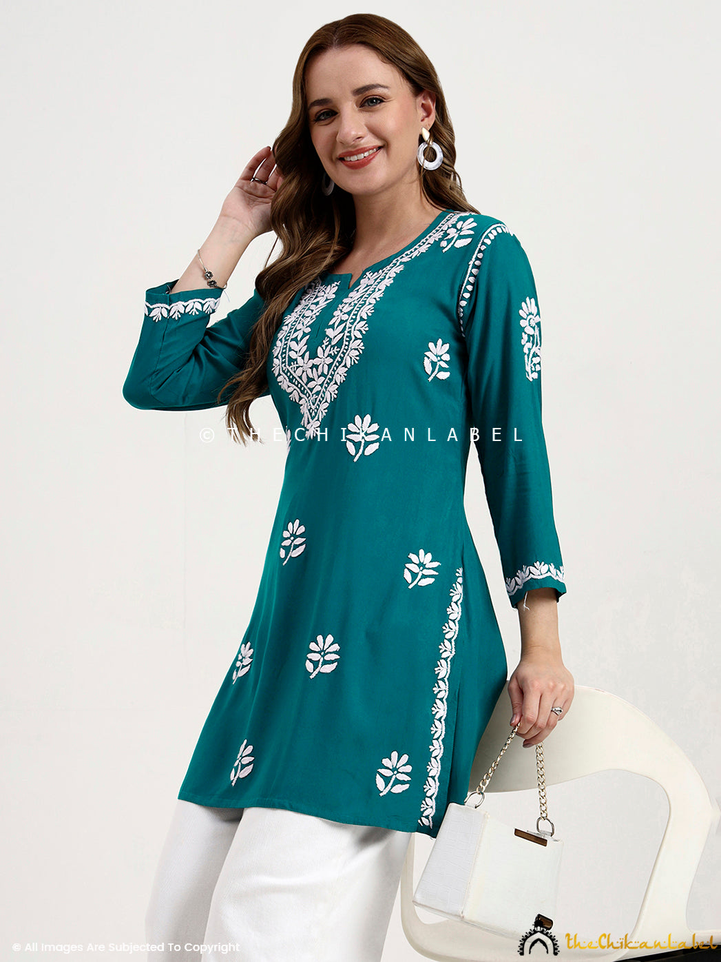 Soft rayon chikankari short top with handcrafted embroidery on front and sleeves.