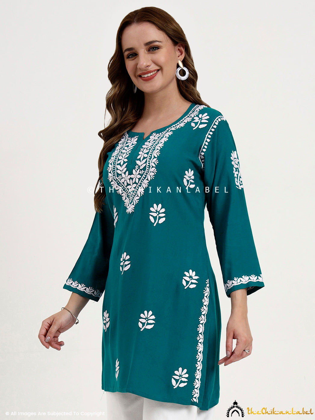 Chikankari short top for women in breathable rayon fabric with traditional handwork.