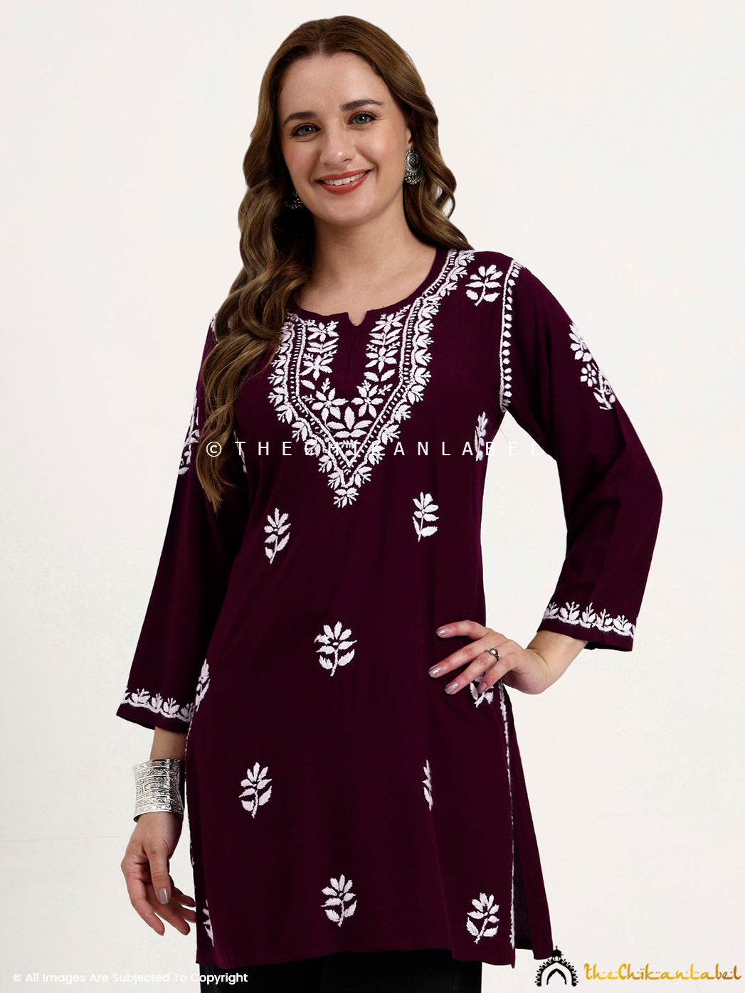 Lightweight rayon chikankari short kurti top for women’s casual and office outfits.