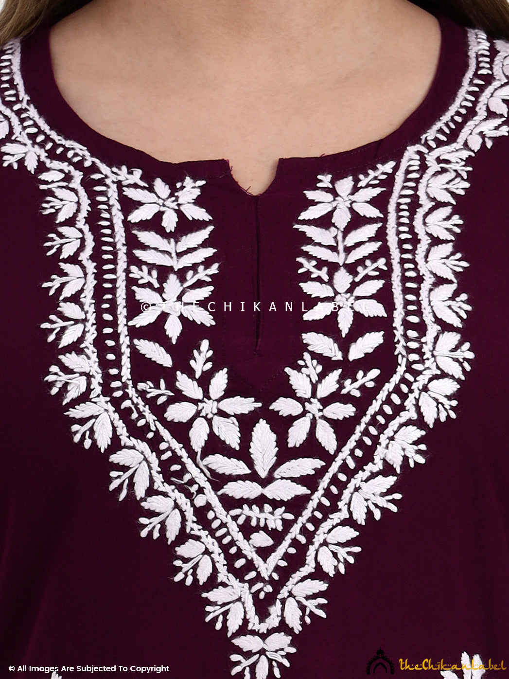 Rayon chikankari short top with intricate thread embroidery and stylish cut.