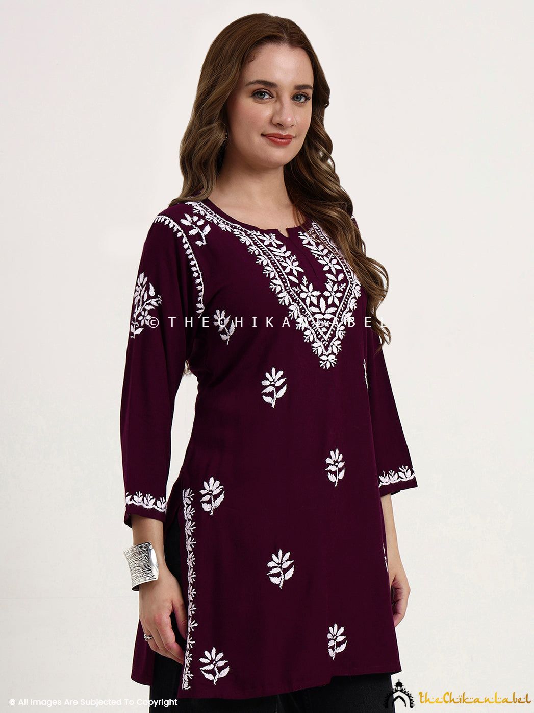 Women’s rayon chikankari embroidered short kurti top for casual and festive wear.